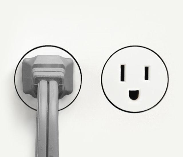 DC Energy Gray 533DC small Air Circulator cord plugged into an outlet