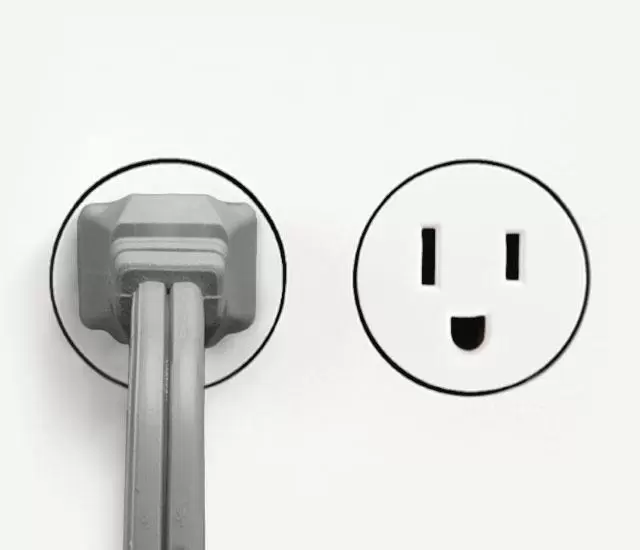 DC Energy Gray 533DC small Air Circulator cord plugged into an outlet