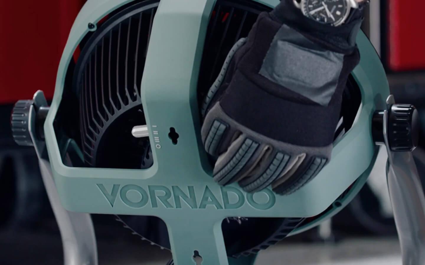 EXO61 HD Controls A gloved hand adjusting EXO61 HD fan Controls