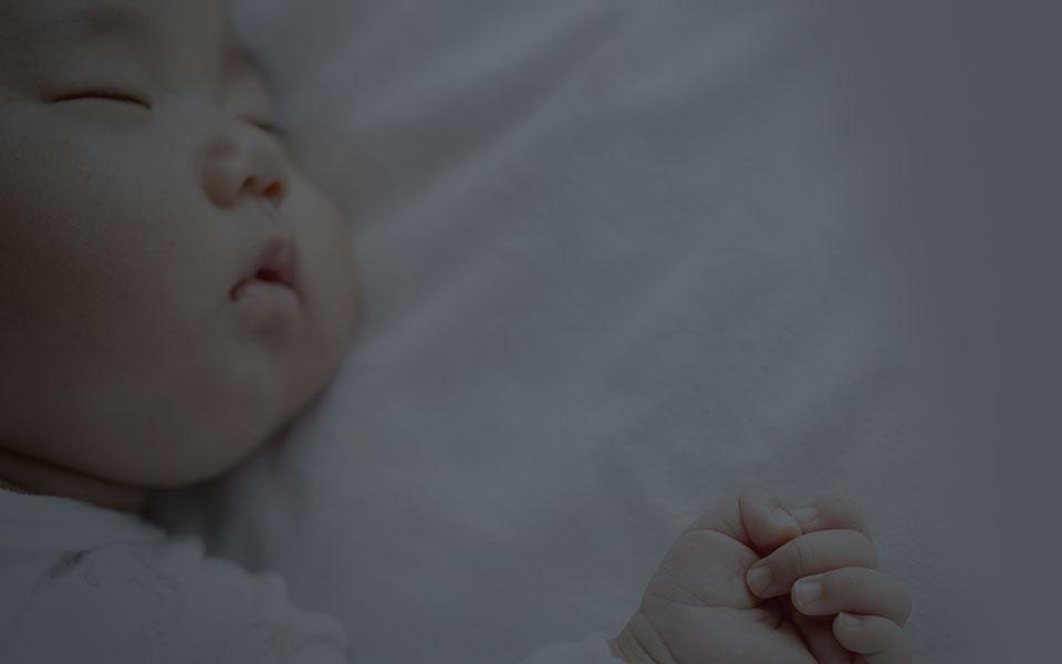 Purio Shhh Sleeping Banner close up of a sleeping baby